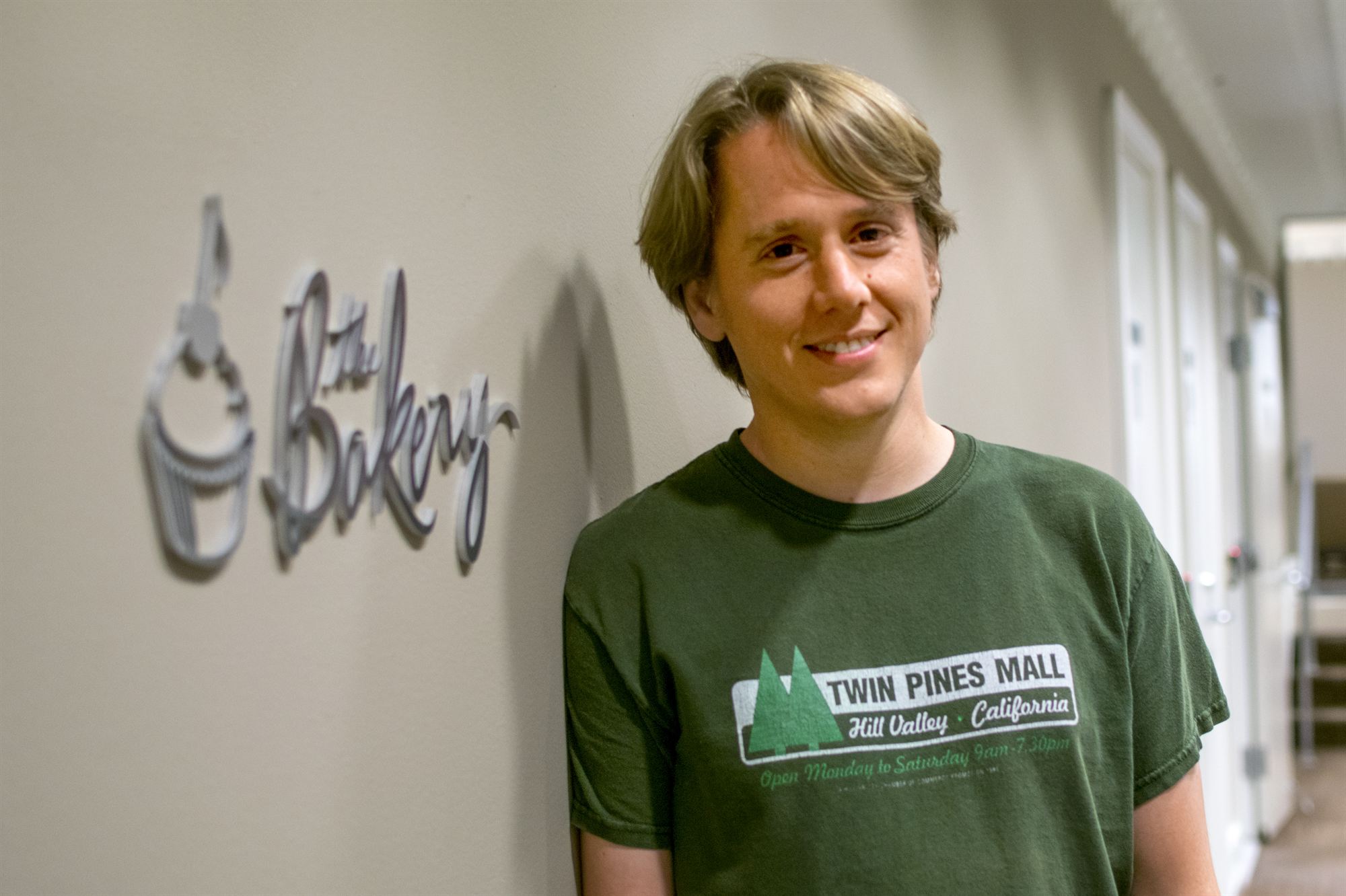 Peter Hewitt-Dutton next to The Bakery sign